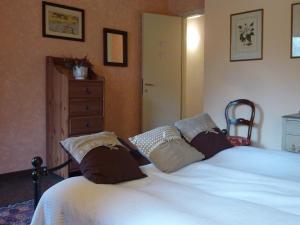 En eller flere senge i et værelse på Cottage L'Armonia