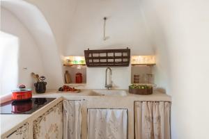 A cozinha ou kitchenette de Trulli 18cinquantanove