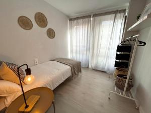 Postel nebo postele na pokoji v ubytování VTZ El Balcón de Plaza Sas + 9 fotografií
