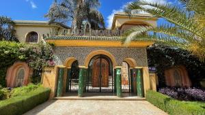 a house with a gate in front of it at Riad Noumidya in F&egrave;s