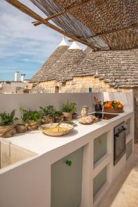 A cozinha ou kitchenette de Trulli 18cinquantanove