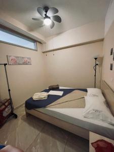 A bed or beds in a room at G&M Luxury Studios