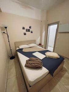 A bed or beds in a room at G&M Luxury Studios