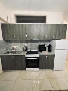 A kitchen or kitchenette at G&M Luxury Studios