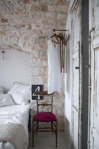 Posteľ alebo postele v izbe v ubytovaní Trulli 18cinquantanove
