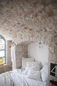 Uma cama ou camas num quarto em Trulli 18cinquantanove