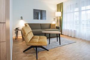 a living room with a couch and a table at Hapimag Ferienwohnungen Winterberg in Winterberg