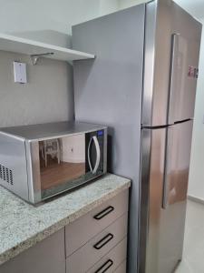 Una cocina o zona de cocina en Apto aconchegante na melhor rua da Vila Andrade!