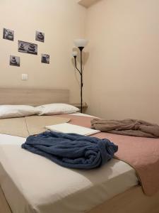 A bed or beds in a room at G&M Luxury Studios