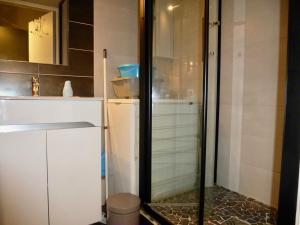 a glass shower in a bathroom with a sink at Boost Your Immo Barèges Oncet PM3 in Barèges