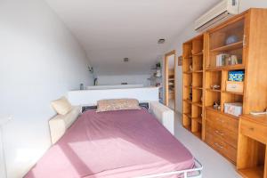 Posteľ alebo postele v izbe v ubytovaní Ático-dúplex geniales vistas al mar