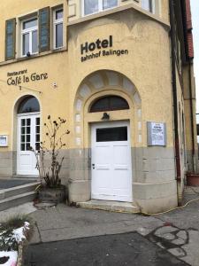 a hotel with a white door on a building at HOTEL Bahnhof Balingen in Balingen