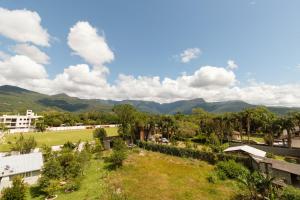 a view of a park with mountains in the background at Hotel Centro dos Canyons in Praia Grande
