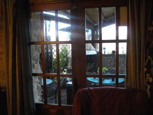 a window with a view of a patio outside at Ca la Serreta in Cretas