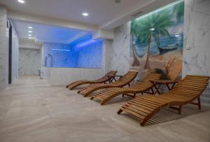 a room with chairs and a painting on the wall at Lime House, Kyustendil in Kyustendil