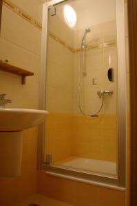 a bathroom with a shower and a sink at Apartmán 302 Oščadnica in Oščadnica