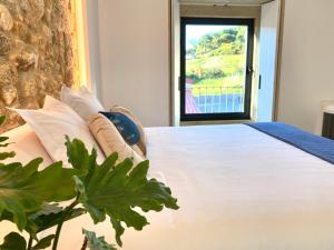 A bed or beds in a room at Morada Atlántica