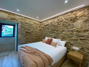 A bed or beds in a room at Morada Atlántica