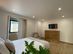 A bed or beds in a room at Morada Atlántica