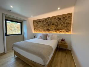 A bed or beds in a room at Morada Atlántica