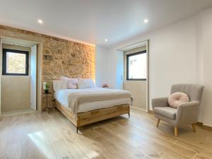A bed or beds in a room at Morada Atlántica