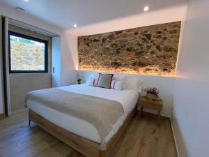 A bed or beds in a room at Morada Atlántica