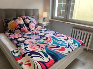 Posteľ alebo postele v izbe v ubytovaní Apartament Przy Katedrze