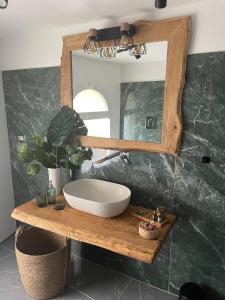 a bathroom with a sink and a mirror at Aurora Luxury Rooms Affittacamere in Naples