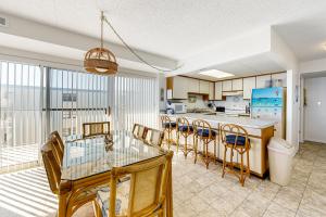 a dining room and kitchen with a table and chairs at Blue Sea Colony 501 in Ocean City