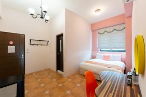 Postel nebo postele na pokoji v ubytování 時光輕旅 Time INN
