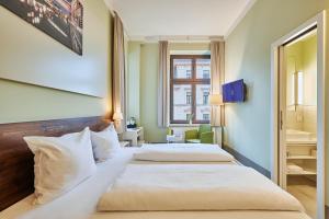 Postel nebo postele na pokoji v ubytování Philippus Inklusionshotel Leipzig + 23 fotografií