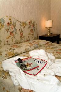 Giường trong phòng chung tại Balletti Palace Hotel