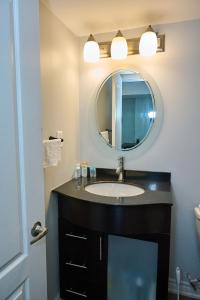 a bathroom with a sink and a mirror at Peace Alcove in Milton