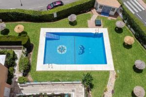 The swimming pool at or close to 797 Holiday Rentals- Atico en Arroyo de la miel con hermosas vistas