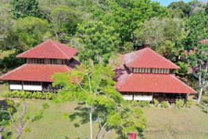 an overhead view of two houses with red roofs at Private Luxury Villa in private beach resort in Telukmataikan