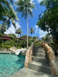 a set of stairs leading to a water slide at Private Luxury Villa in private beach resort in Telukmataikan
