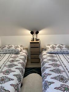 Łóżko lub łóżka w pokoju w obiekcie Apartament BB I na Kiepury