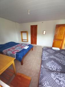 Ein Bett oder Betten in einem Zimmer der Unterkunft Hotel CHAFO