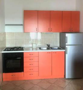 Kuchyň nebo kuchyňský kout v ubytování Apartments Pisac