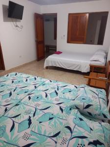 Ein Bett oder Betten in einem Zimmer der Unterkunft Hotel CHAFO