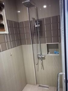 a shower stall in a bathroom with a shower at Avana Hills Tagaytay Villa in Tagaytay
