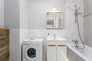 Koupelna v ubytování Chill Apartments Ursus + 37 fotografií