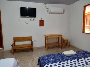 Ein Bett oder Betten in einem Zimmer der Unterkunft Hotel CHAFO