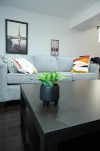 a living room with a couch and a coffee table at Peace Alcove in Milton