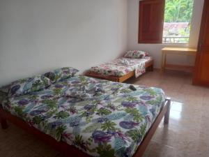 Ein Bett oder Betten in einem Zimmer der Unterkunft Hotel CHAFO