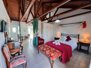 a bedroom with a large bed with a red blanket at Forestata Village in Lixouri +122 photos