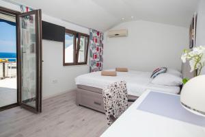 Cama ou camas em um quarto em Villa Mona 2