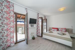 Cama ou camas em um quarto em Villa Mona 2