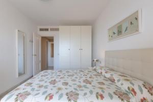 A bed or beds in a room at Atico Lujoso
