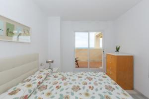 A bed or beds in a room at Atico Lujoso